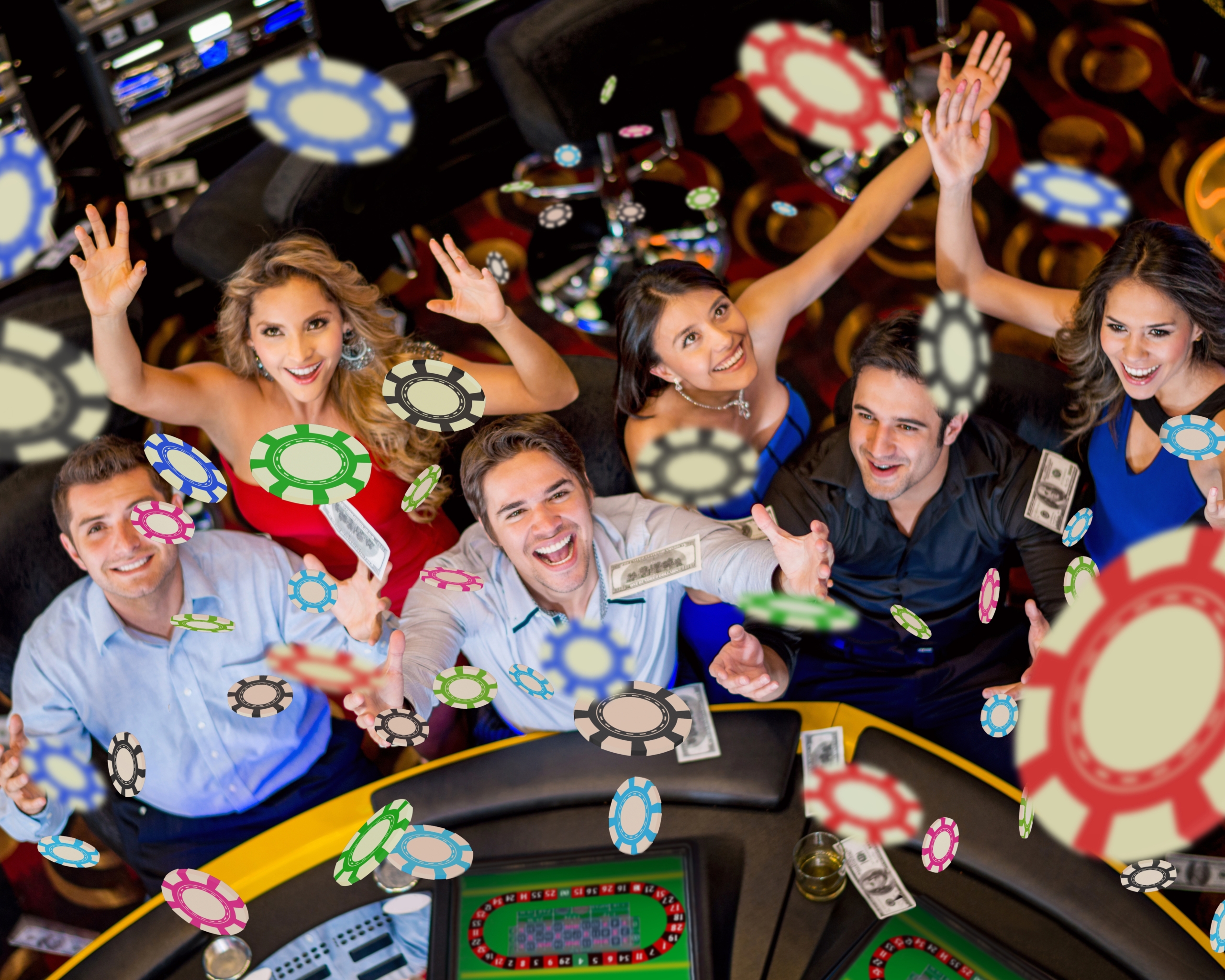groupe de collègues pris en vue plongeante en train de lancer des jeton de casino lors d'un team building casino et jeux en bois par glad events à St Brieuc